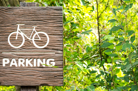 A bicycle / bike on bridge with sunlight and green tree in park outdoor for backgroundの写真素材