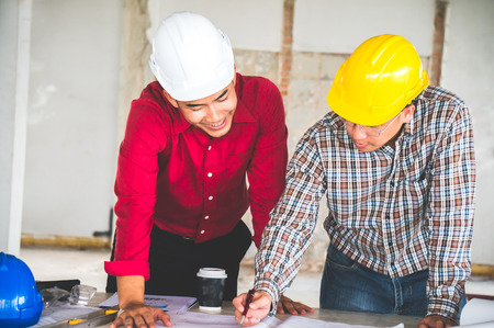 Engineer and foreman meeting on siteの写真素材
