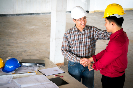 Engineer and foreman discuss on siteの写真素材