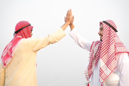 Arab businessman meet and greet with colleagueの写真素材