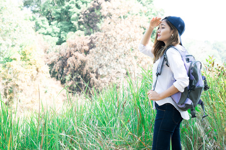 Asian woman feeling relax in green forestの写真素材