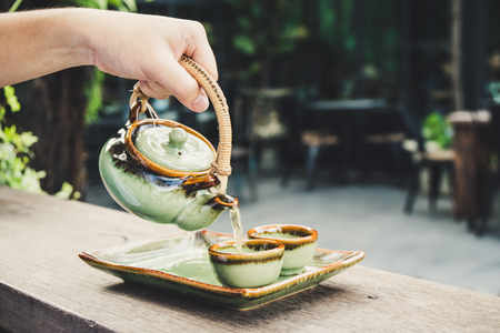 Pour tea by teapot Asian Styleの写真素材