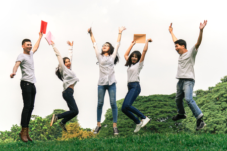 Asian students feeling happy after completed final examの写真素材