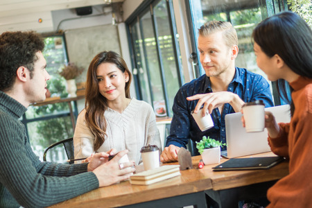 Young businessman and woman meeting and share idea to colleagueの写真素材