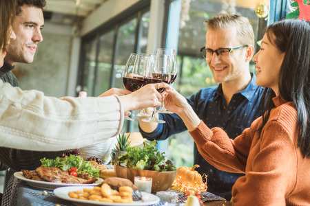 Dinner for Christmas party with family and friend with turkey, salad, steak and red wine.の写真素材