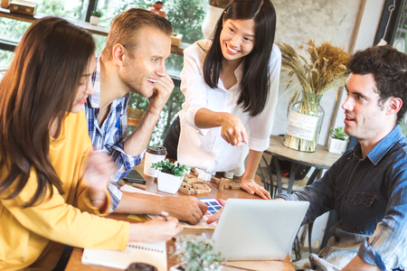 Young businessman and woman meeting and share idea to colleagueの写真素材