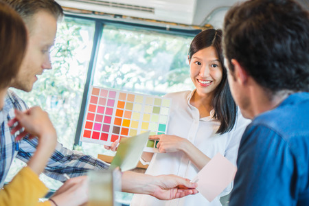 Young businessman and woman meeting and share idea to colleagueの写真素材