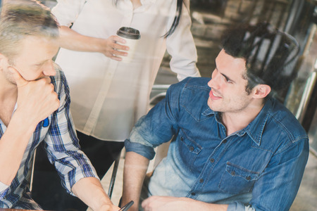 Young businessman and woman meeting and share idea to colleagueの写真素材