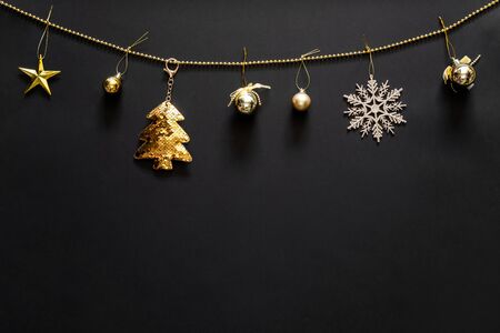 Christmas background with decoration, gold tree, snow flake, bubbles and star with copy space. Flat lay, top view.の写真素材