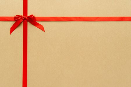 Christmas gift composition with red ribbin and bow. Flat lay, top viewの写真素材