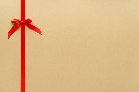 Christmas gift composition with red ribbin and bow. Flat lay, top viewの写真素材