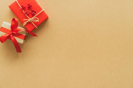 Christmas gifts on paper background with copy space. Flat lay, top viewの写真素材