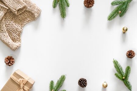 Christmas background with decoration, gift, pine cones, branchs, gold bubble and Knitting sweater and copy spaceの写真素材
