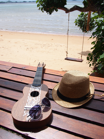 Relax on the beach with hat sun glass and guitarの写真素材