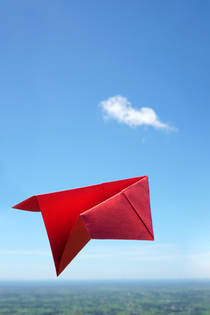 Red paper planeの写真素材
