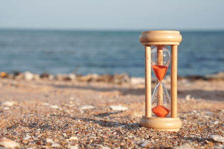 Hourglass Clock on the Sand Beach