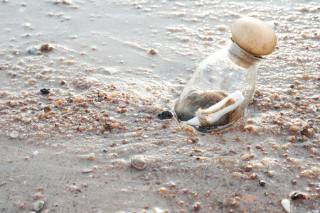 bottle with a message on the beach