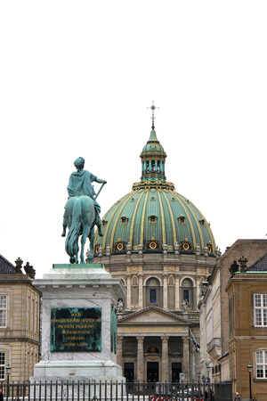 Copenhagen, Denmark - April 17, 2018: Frederik V of Denmark statue at Copenhagen's Amalienborg or Royal Palace courtyard with dome of Marble church (Frederik's Church) behind in Copenhagen, Denmarkのeditorial素材
