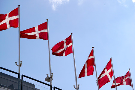 Denmark flag on a mat in the wind and blue skyの写真素材