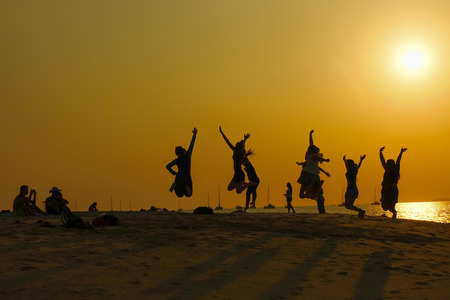 Jumping People on the beachの写真素材