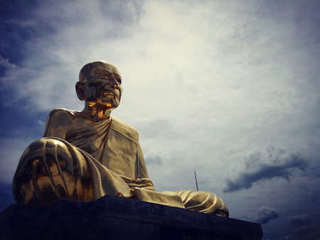 Gold monk sculptureの写真素材