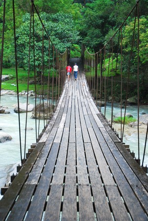 Go together at the rope bridgeの写真素材