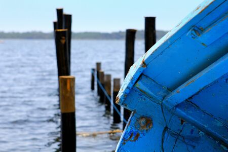 Urbino lake, boat in dry and mooring polesの写真素材