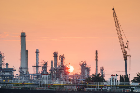 oil refinery industry plant along sunriseの写真素材