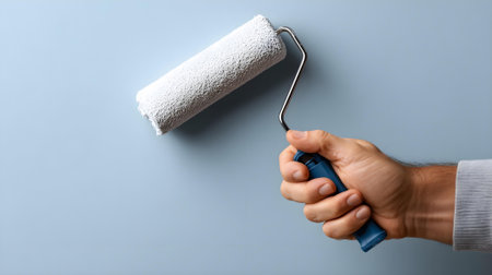 Man painting wall with paint roller, closeup. Space for text.ai generatedの素材
