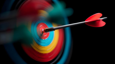 3d illustration of red arrow hitting the center of dartboard on black background.ai generated. ai generatedの素材