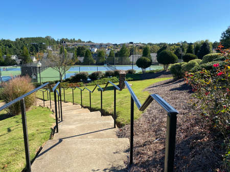 the stairs leading down the tennis courtの写真素材