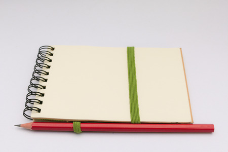pencil on Note book isolated on white backgroundの写真素材