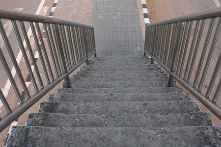 Old stairs of the overpass in the cityの写真素材