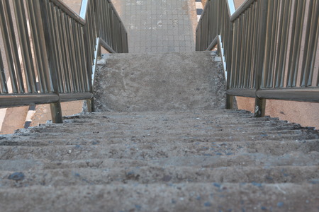 Old stairs of the overpass in the city