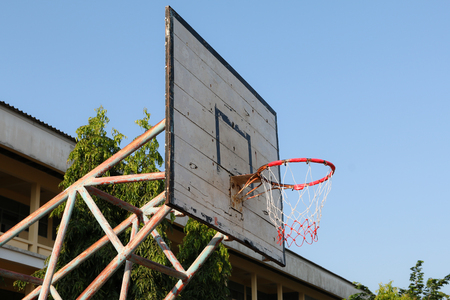 Basketball Hoop and Court With wood White Backboard,street basketball board with the blue skyの写真素材