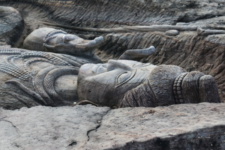 Carving in buddhist temple cave phadan, sakonnakhon,Thailandの写真素材
