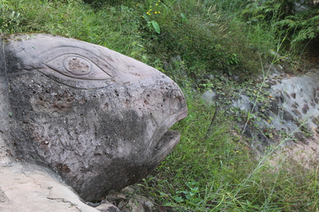 Carving in buddhist temple cave phadan, sakonnakhon,Thailandの写真素材