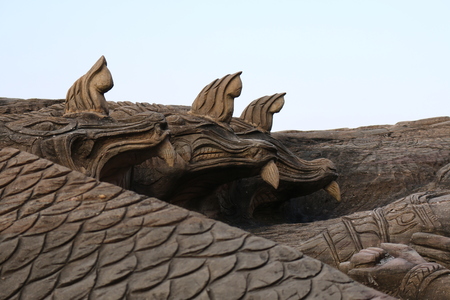 Carving in buddhist temple cave phadan, sakonnakhon,Thailandの写真素材