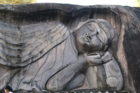Carving in buddhist temple cave phadan, sakonnakhon,Thailandの写真素材