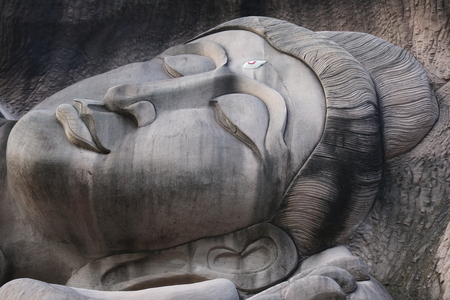 Carving in buddhist temple cave phadan, sakonnakhon,Thailandの写真素材