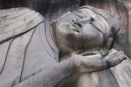 Carving in buddhist temple cave phadan, sakonnakhon,Thailandの写真素材