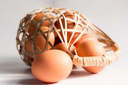 egg in basket wicker on white background,Duck eggs in baskets .
