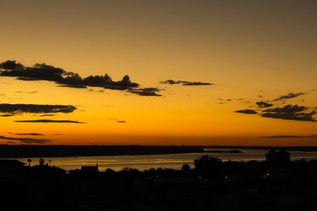 Sunrise over Mekong River in a Mukdahan city skylinの写真素材