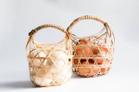 egg in basket wicker on white background,Duck eggs in baskets .の写真素材