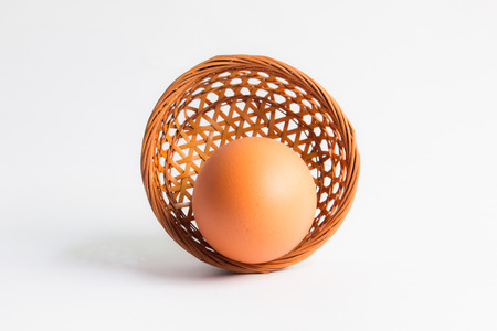 egg in basket wicker on white background,Duck eggs in baskets .の写真素材