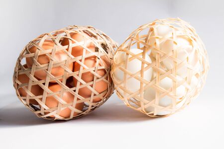 egg in basket wicker on white background,Duck eggs in baskets .の写真素材