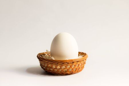 egg in basket wicker on white background,Duck eggs in baskets .の写真素材