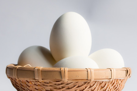 egg in basket wicker on white background,Duck eggs in baskets .の写真素材
