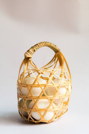 egg in basket wicker on white background,Duck eggs in baskets .の写真素材