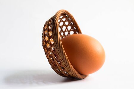 egg in basket wicker on white background,Duck eggs in baskets .の写真素材